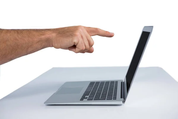 Male executive pointing at laptop — Stock Photo, Image