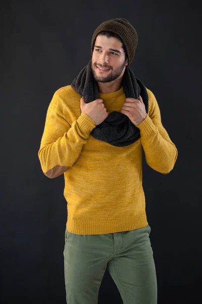 Smiling man holding scarf — Stock Photo, Image