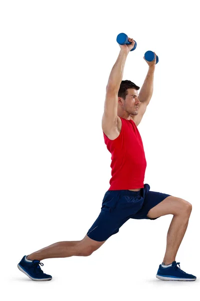 Sports player exercising with dumbbells — Stock Photo, Image