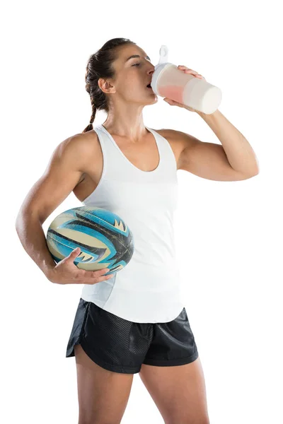 Female rugby player holding ball — Stock Photo, Image