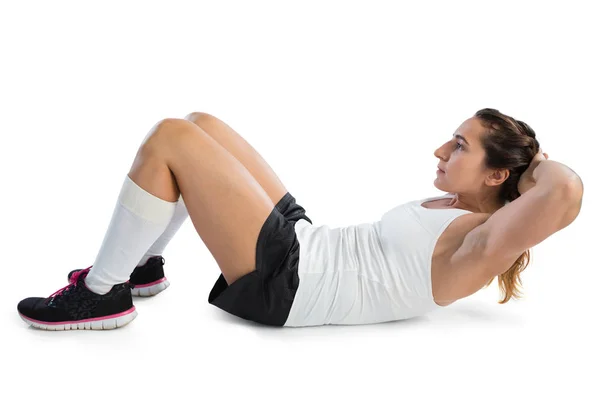 Female athlete practicing sit ups — Stock Photo, Image