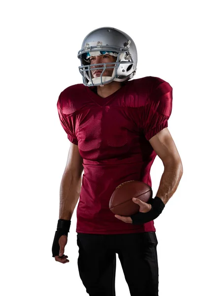 Jogador de futebol americano usando capacete esportivo — Fotografia de Stock