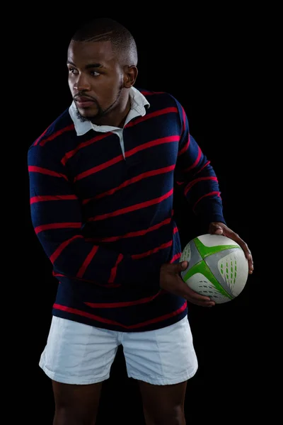 Male athlete holding rugby ball — Stock Photo, Image