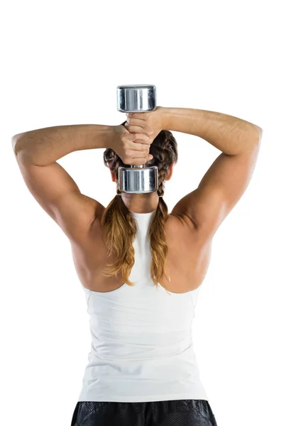 Female rugby player exercising with dumbbell — Stock Photo, Image