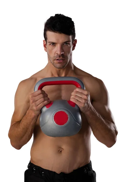 Deportista sin camisa haciendo ejercicio con la campana de la tetera —  Fotos de Stock