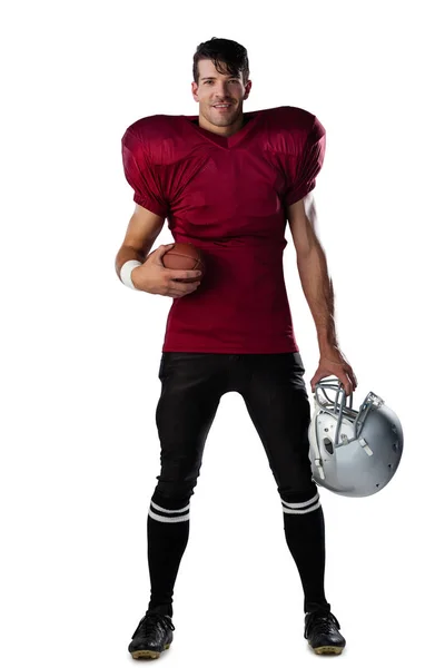Giocatore di football americano in possesso di palla e casco — Foto Stock