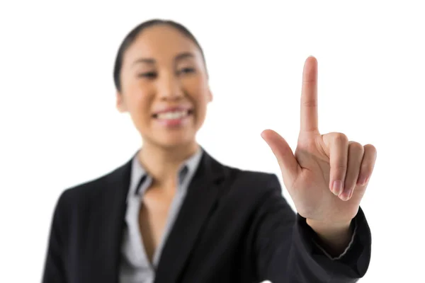 Businesswoman pressing an invisible virtual screen — Stock Photo, Image