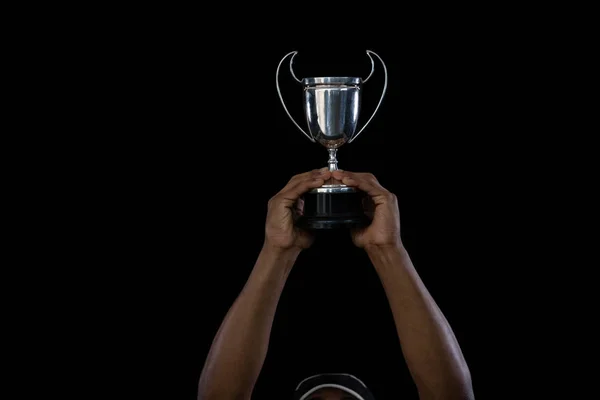 Cropped hand on sportsperson holding trophy — Stock Photo, Image