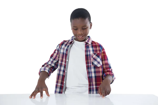 Boy pretending to touch an invisible screen — Stock Photo, Image