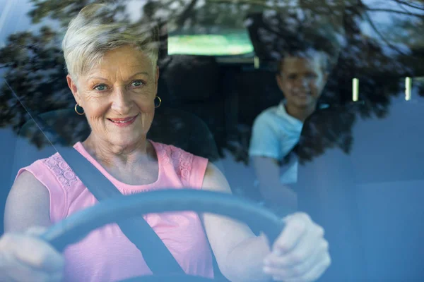 Grandmother driving car — Stock Photo, Image