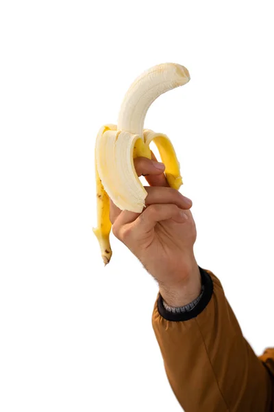 Hand holding gepelde banaan — Stockfoto