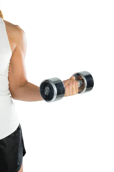 Female player exercising with dumbbell — Stock Photo, Image