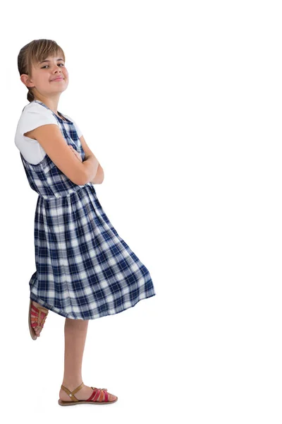 Cute girl standing with arms crossed — Stock Photo, Image