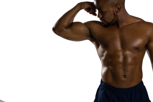 Deportista sin camisa flexionando músculos — Foto de Stock