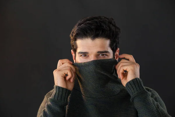 Portrait of man hiding face from scarf — Stock Photo, Image