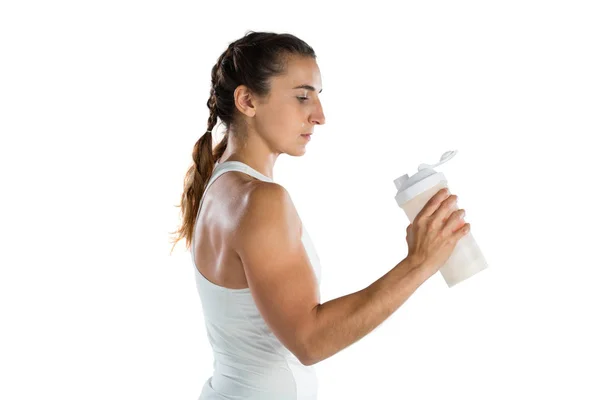 महिला एथलीट बोतल पकड़े हुए — स्टॉक फ़ोटो, इमेज