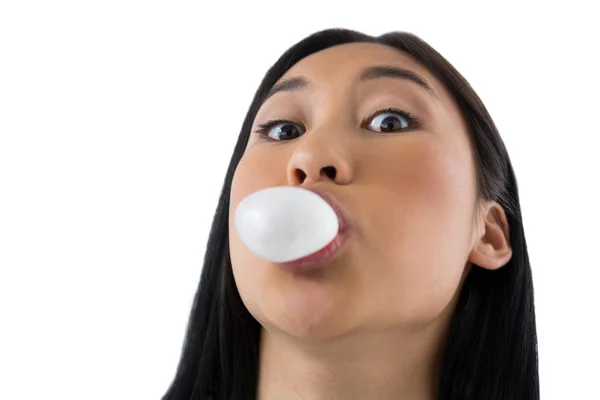 Woman blowing bubble gum — Stock Photo, Image