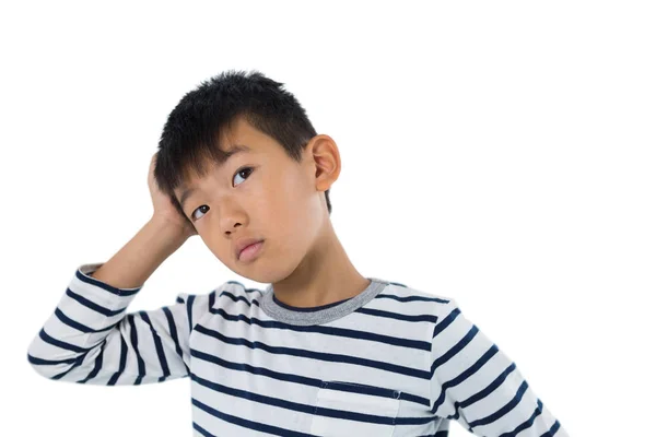 Boy standing against white background — Stock Photo, Image