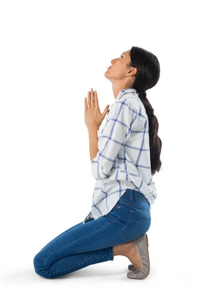 Woman praying against white background — Stock Photo, Image