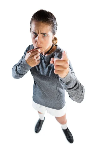 Female coach gesturing while whistling — Stock Photo, Image