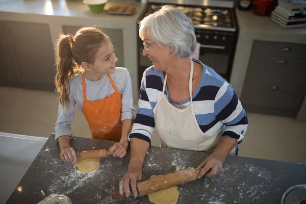 Grandmother and granddaughter looking at each other — Stock Photo, Image