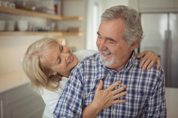 Senior couple hugging each other — Stock Photo, Image