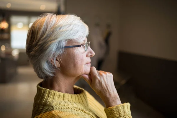 Senior woman standing at home — Stock Photo, Image