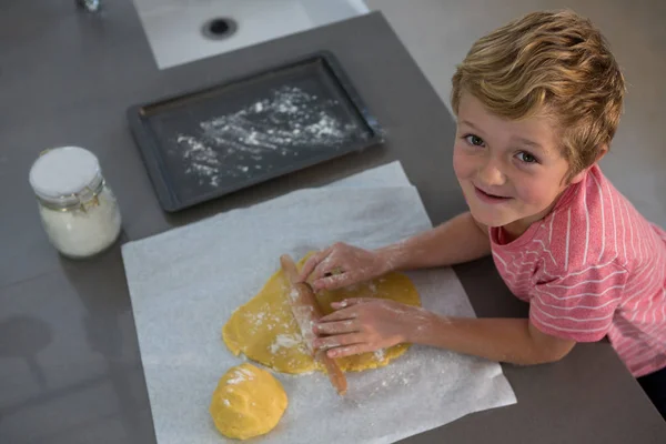 Portrait of boy rolling dough — Stock Photo, Image