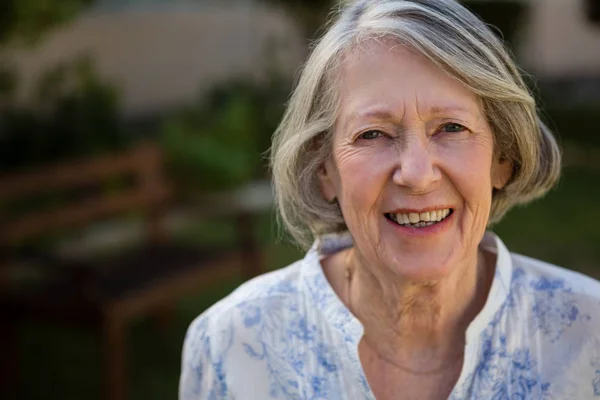 Happy senior woman at park — Stock Photo, Image