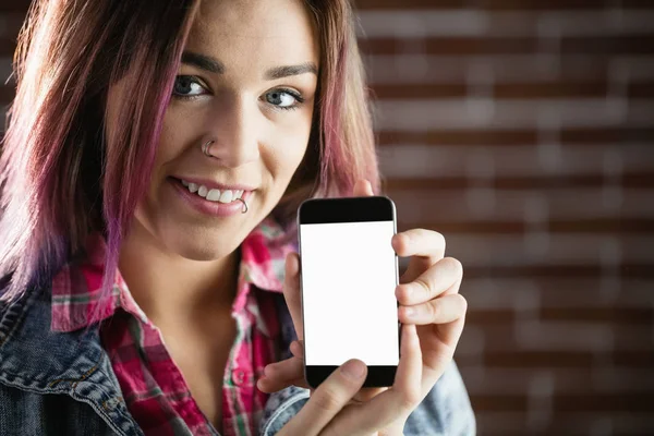 Smiling woman showing phone — Stock Photo, Image