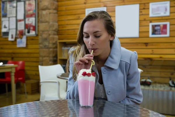 Woman having drink — Stock Photo, Image