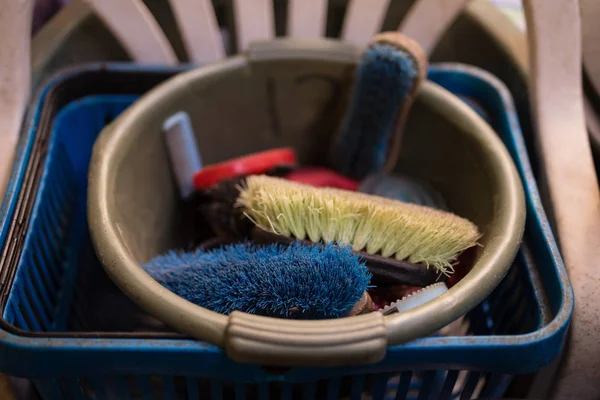 Colorful brushes in bucket — Stock Photo, Image