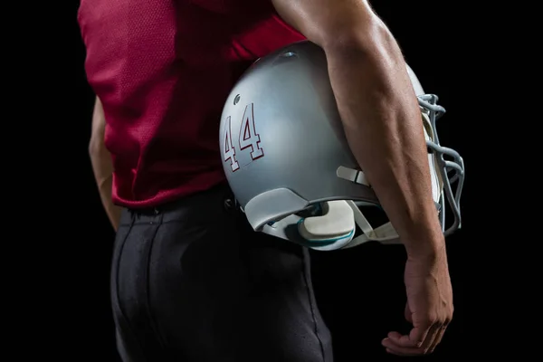 Football player holding head gear — Stock Photo, Image