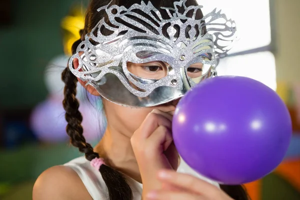 Adorable girl blowing balloon — Stock Photo, Image