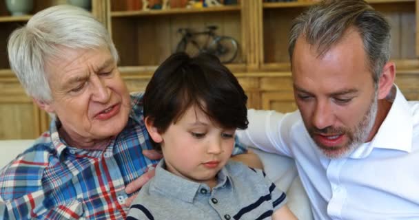 Son, father and grandfather using laptop — Stock Video