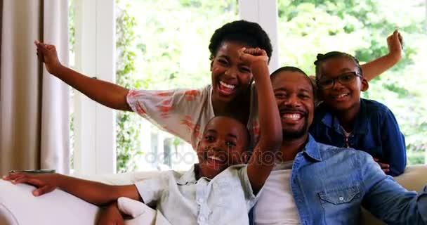 Parents and kids having fun while watching television — Stock Video