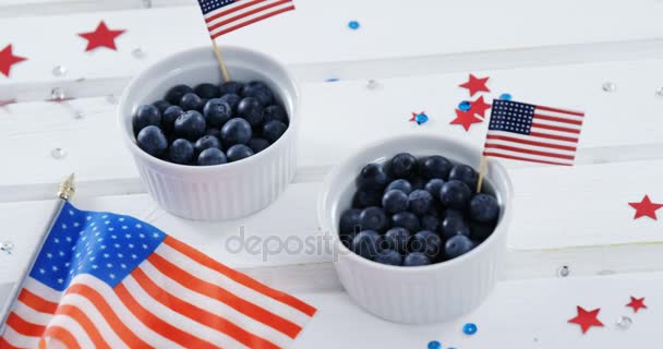 Blueberries in bowl with American flag — Stock Video