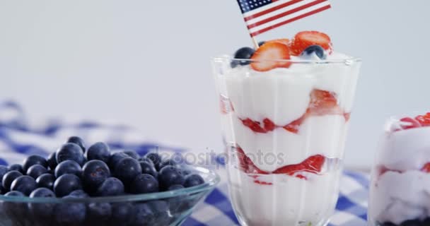 Fruit ice creams on wooden table — Stock Video