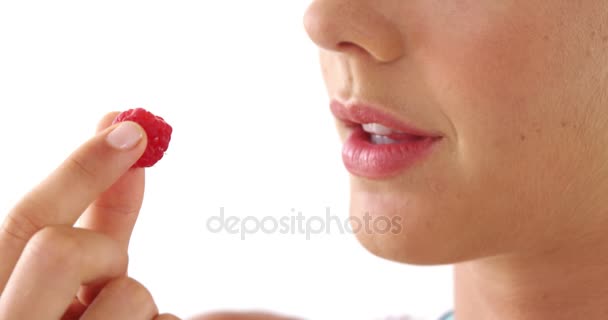 Close-up of woman having raspberries — Stock Video
