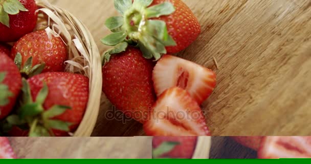 Fresh strawberries in wicker bowl — Stock Video