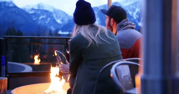 Couple interacting nearby campfire — Stock Video