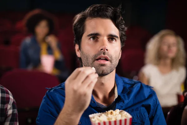 Man watching movie in theatre — Stock Photo, Image