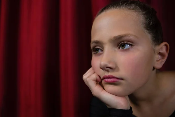 Ballerina sitting on the stage in theater — Stock Photo, Image