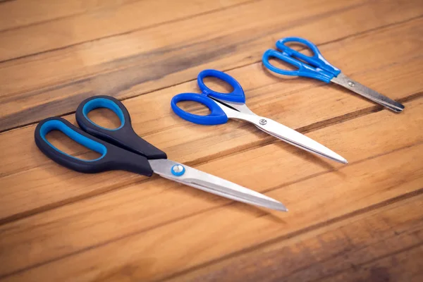 Scissors on wooden table — Stock Photo, Image