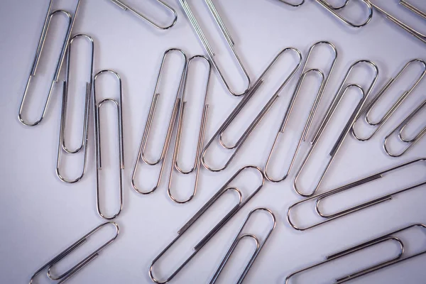 Directly above shot of metallic paper clips — Stock Photo, Image
