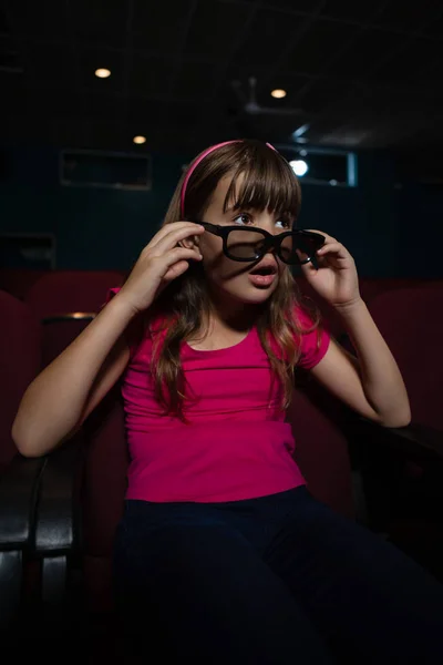Girl using 3D glasses while watching movie — Stock Photo, Image