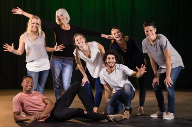 Actors practicing play on stage clipart