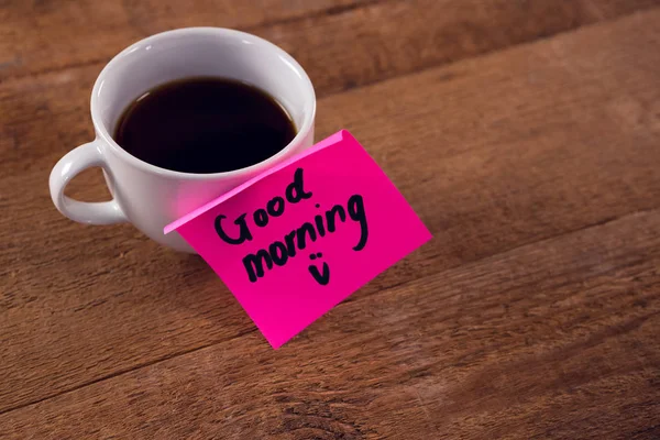 Coffee with message on wooden plank — Stock Photo, Image