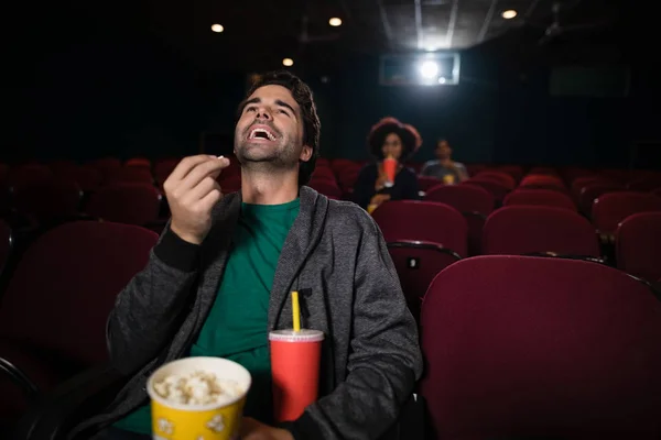 Man watching movie in theatre — Stock Photo, Image