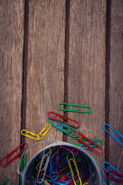 Colorful paper clips by container — Stock Photo, Image